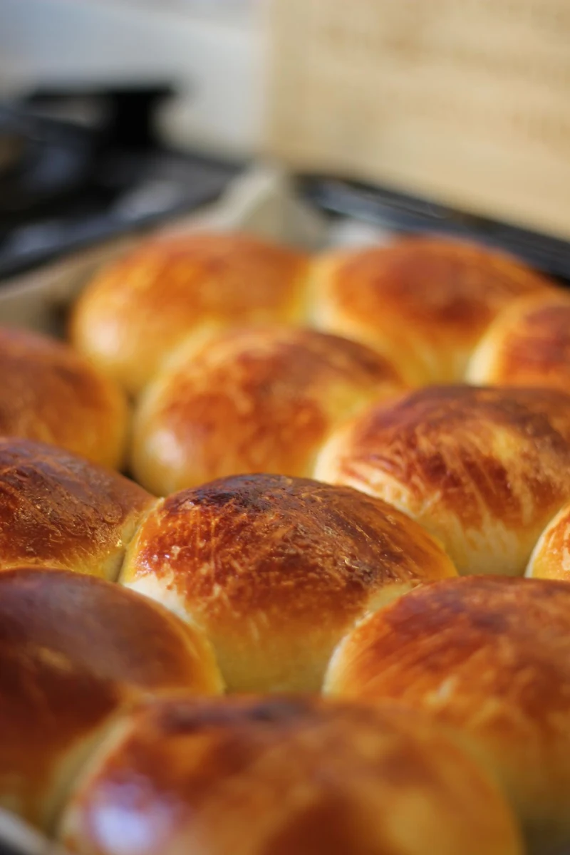 Representative golden bread rolls baked closely together